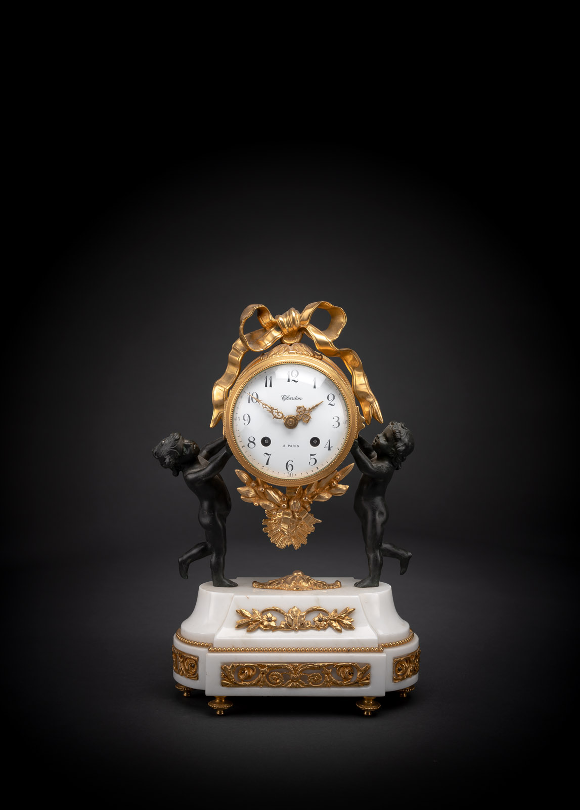 <b>A FRENCH NEOCLASSICAL GILT BRONZE AND WHITE MARBLE PENDULE</b>
