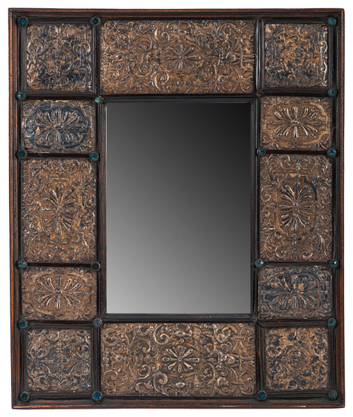 The rectangular plate within a moulded rectangular frame set with 12 embossed and gilt brass plates and various blue glass stones. Traces of age.