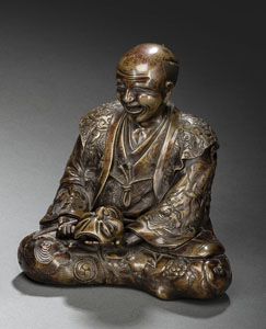 <b>A BRONZE MODEL OF A SEATED MASK MAKER</b>