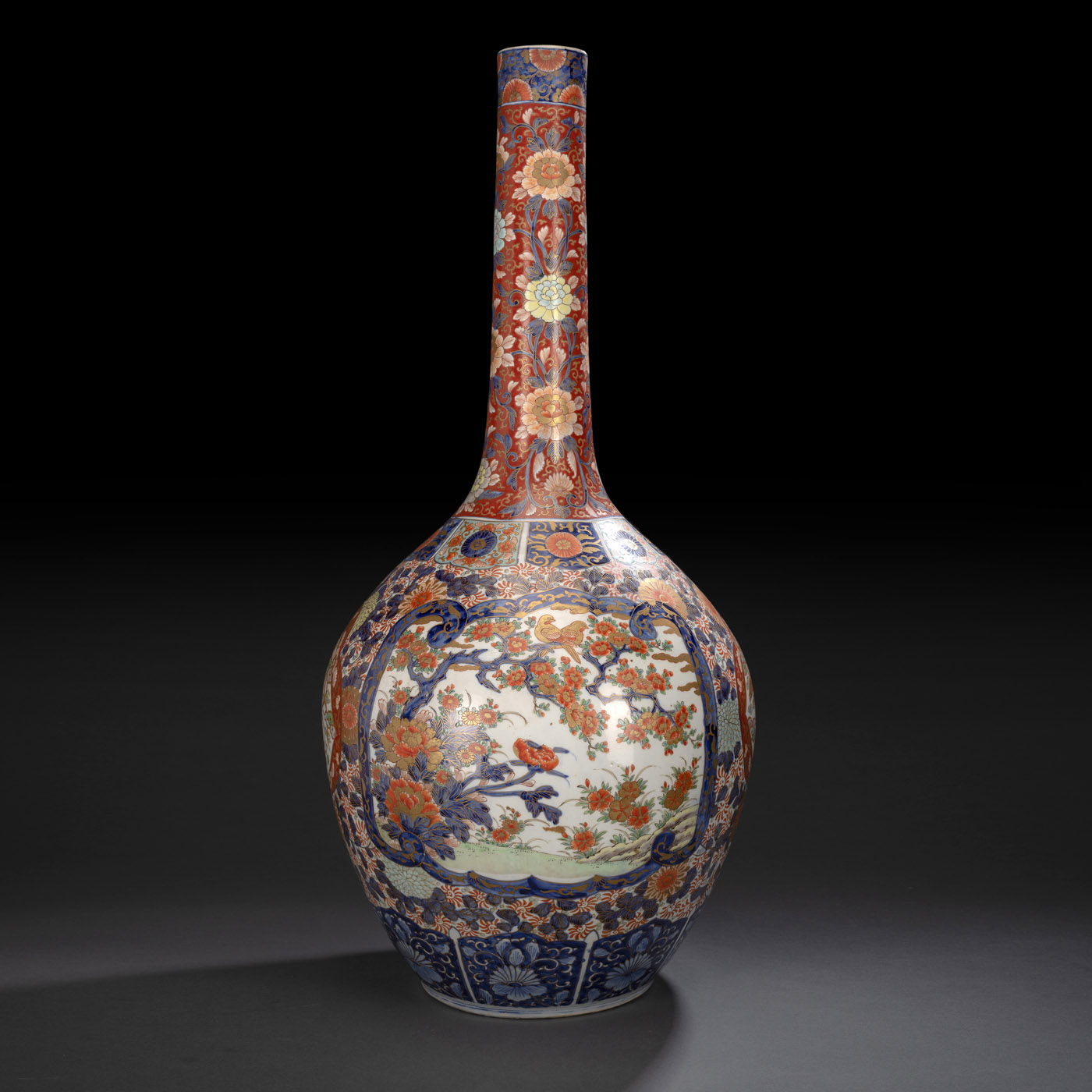 <b>A LARGE NARROW-NECKED IMARI PORCELAIN VASE DECORATED WITH BIRDS AND FLOWERS</b>