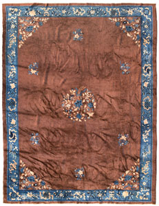 <b>A BEIJING CARPET WITH FLORAL MEDAILLON ON BROWN GROUND</b>