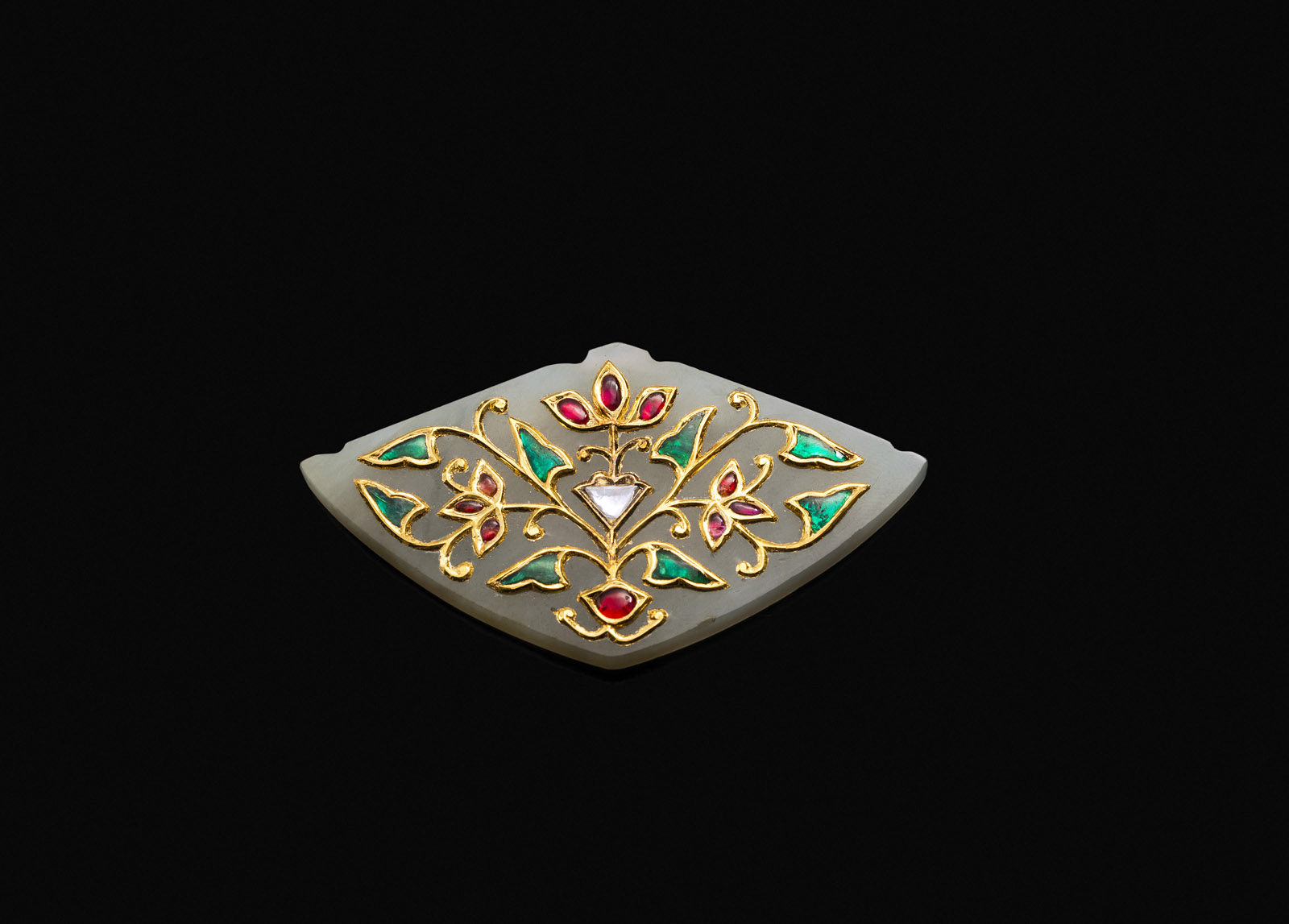 <b>A CARVED LIGHT GREEN JADE PENDANT DECORATED WITH GOLD, DIAMONDS, RUBIES AND EMERALDS IN MUGHAL STYLE</b>