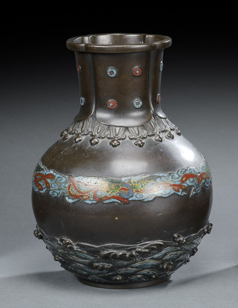 <b>A BRONZE VASE DECORATED WITH WAVES AND A BORDER OF HOO BIRDS IN CHAMPLEVE TECHNIQUE</b>