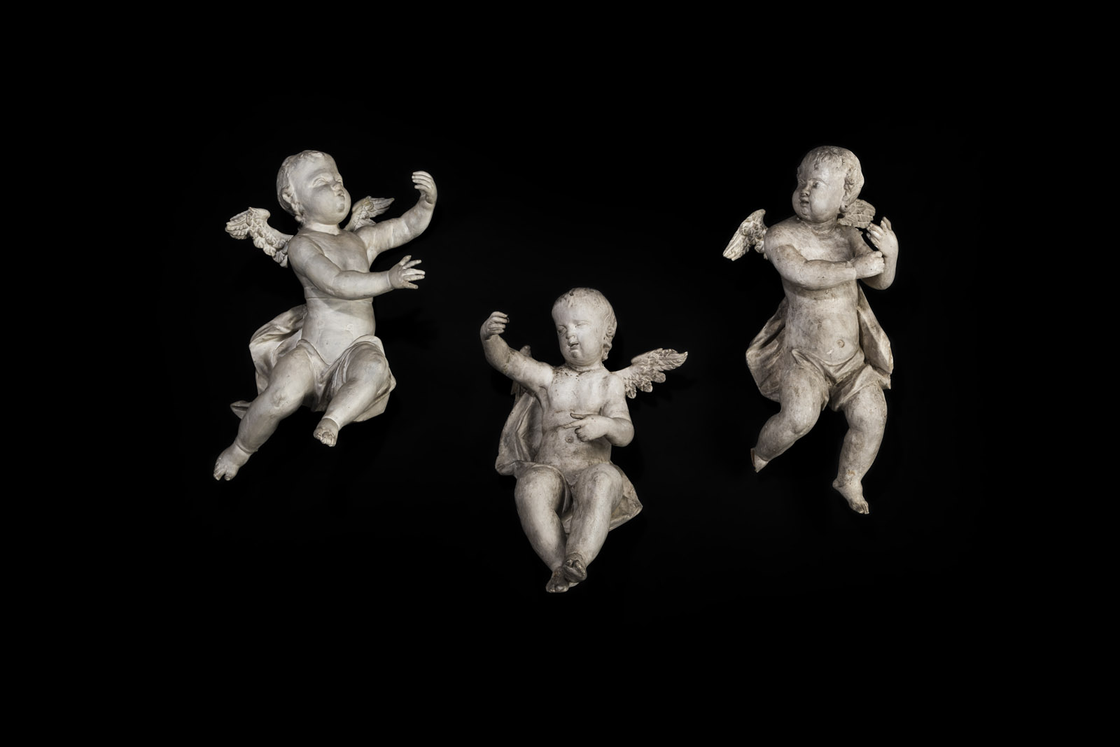<b>A GROUP OF THREE BAROQUE WINGED PUTTI</b>
