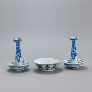 <b>A PAIR OF BLUE AND WHITE PORCELAIN CANDLESTICKS AND A BOWL</b> <b>A PAIR OF BLUE AND WHITE PORCELAIN CANDLESTICKS AND A BOWL</b>