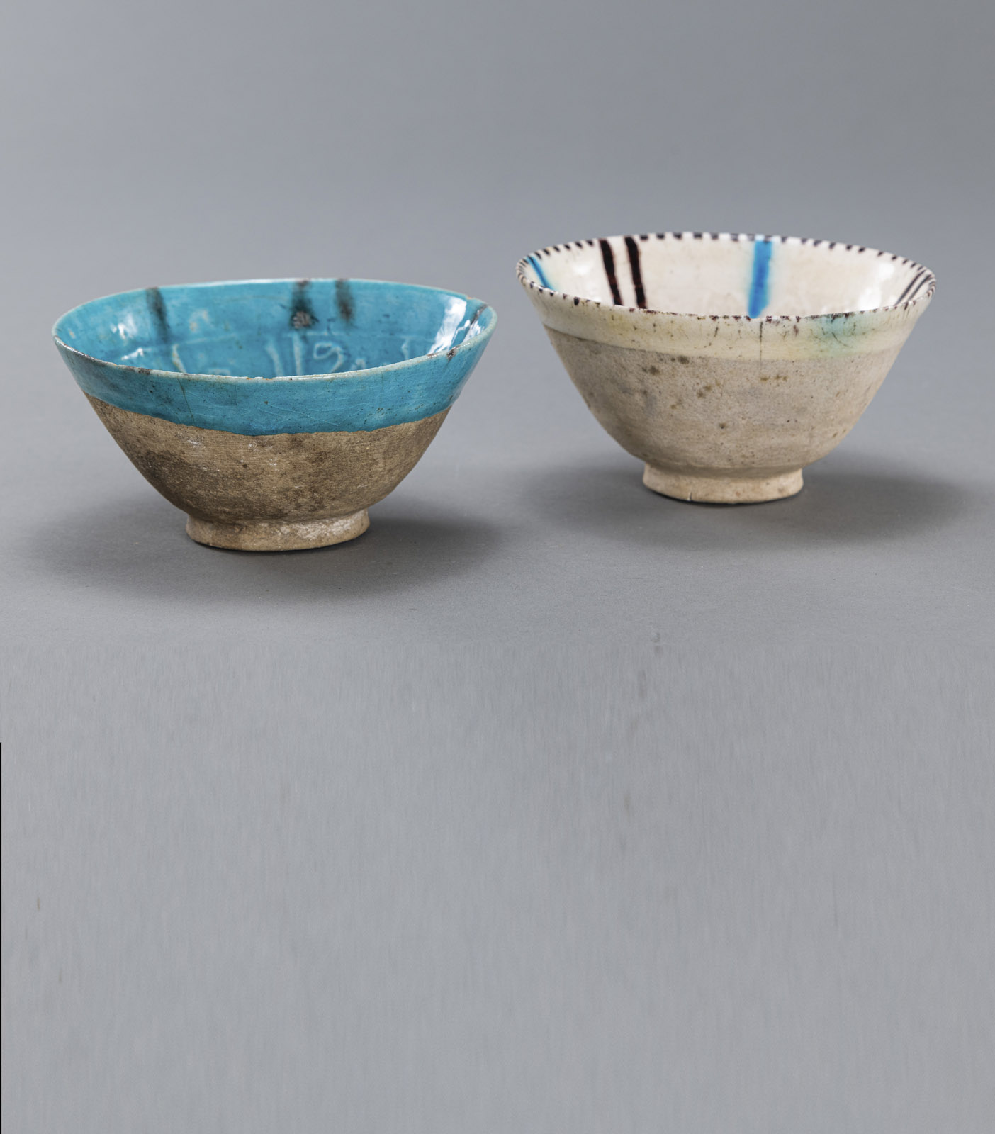 <b>TWO GHAZNAVIDE MOULDED AND POLYCHROME GLAZED POTTERY BOWLS</b>