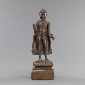<b>A BRONZE FIGURE OF BUDDHA STANDING ON A LOTUS</b>