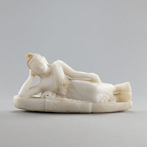 <b>A CARVED ALABASTER FIGURE OF RECLINING BUDDHA</b>