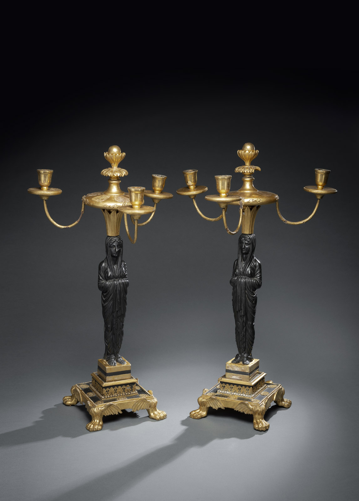 <b>A PAIR OF WOOD AND STUCCO EMPIRE CANDELABRA</b>