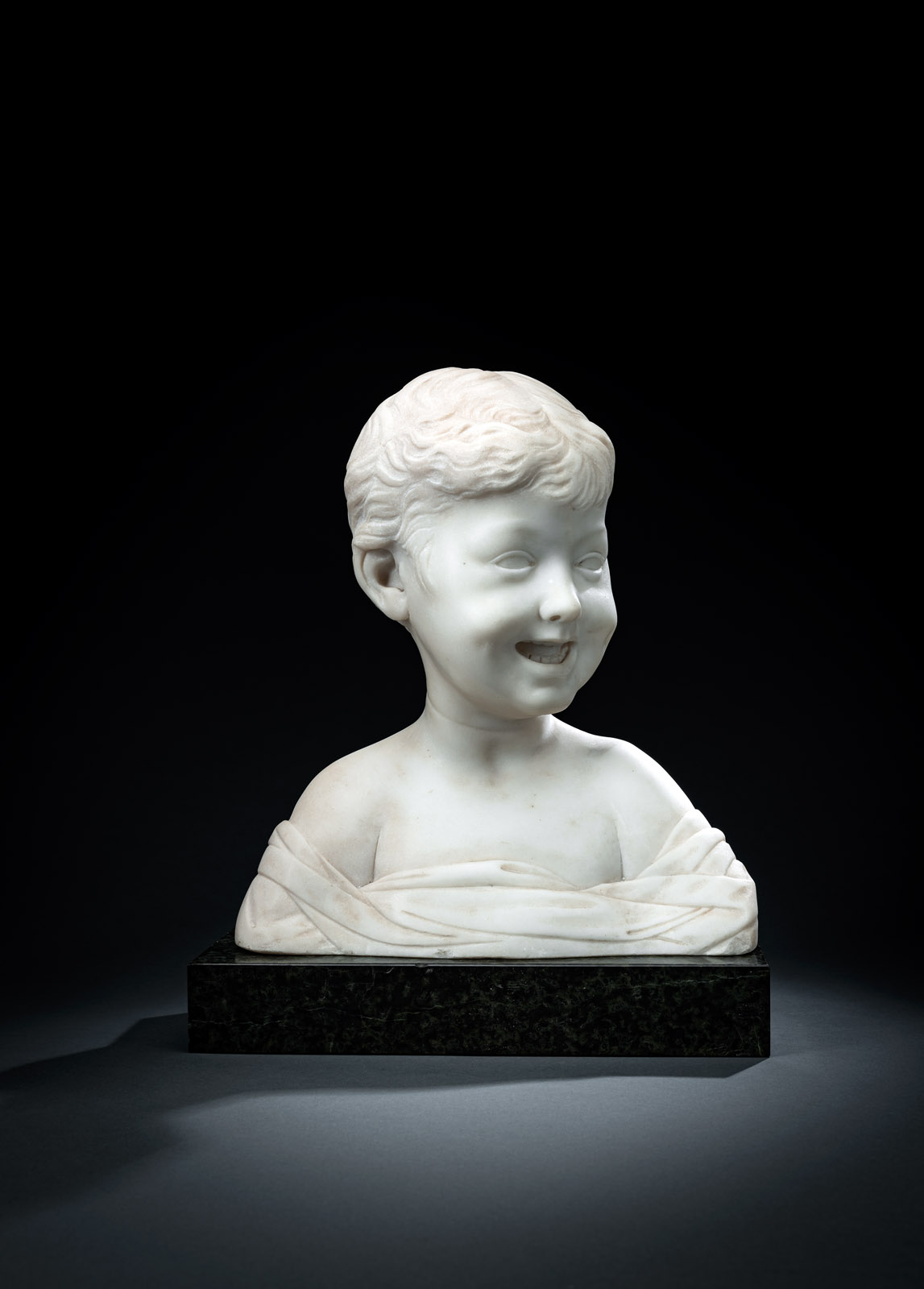 <b>A MARBLE BUST OF A LOUGHING BOY</b>