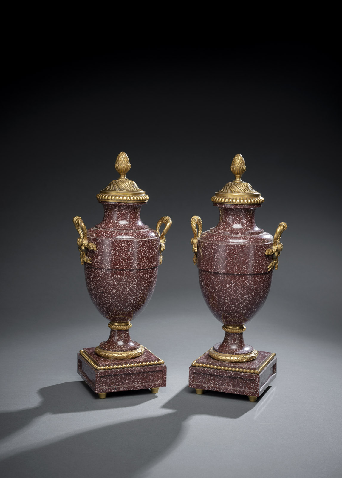 <b>A PAIR OF ORMOLU MOUNTED PORPHYRY VASES AND COVERS</b>